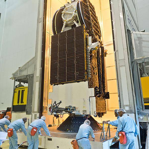 A team of people are working on nbn's Sky Muster Satellite prior to it being launched into space