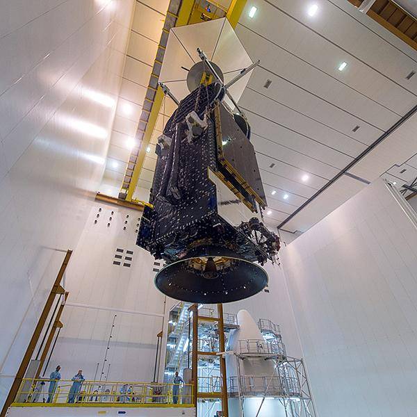 nbn's Sky Muster satellite hanging inside a building prior to being launched into space